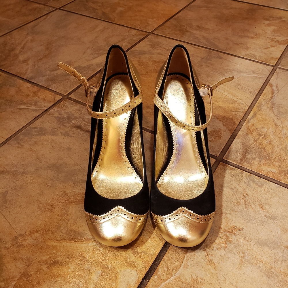 Black and gold Mary jane Coach shoes